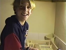 Matthew washes the dishes after dinner - willingly!